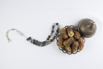 luxury Rosary beads with Dates fruits isolated on a white background