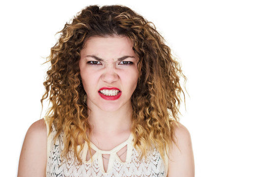 angry girl on white background show teeth