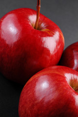 Closeup of red apples on black background