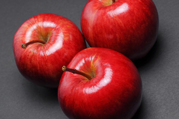 Closeup of red apples on black background