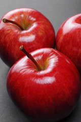 Closeup of red apples on black background