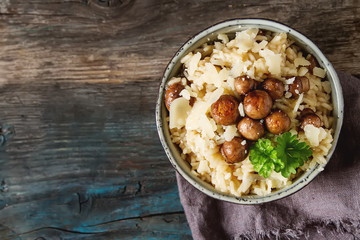 Mushroom risotto with parmesan cheese. Italian food. Simple background.