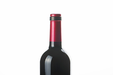 Clear bottle forwine with red top isolated on white. Close up.
