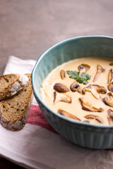 Cream Mushroom Soup in Bowl on Stone Background. Homemade Mushrooms Pottage Puree.