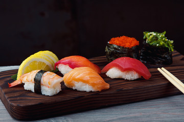 Fresh Sushi set with salmon, prawns and tuna. Traditional Japanese cuisine.