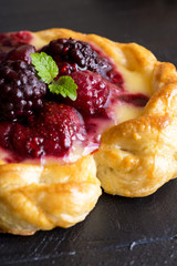 Vanilla Cream and Fruit Berry Puff Pastry Dessert on Dark Background