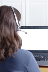 woman headset laptop blank monitor