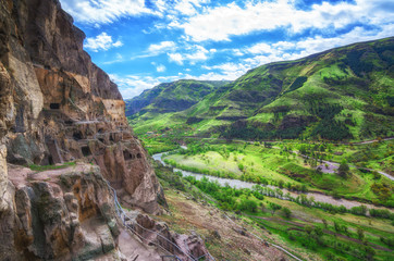 Tourists visiting Vardzia ancient cave city on a spring day in May. Vardzia is one of the main attraction in Georgia