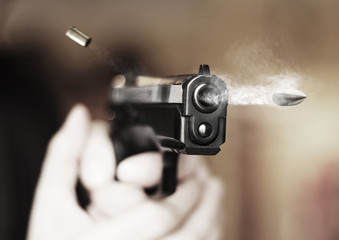 man with hand gun pistol rubber attack violence