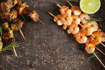 Mini barbecue with tuna and shrimp on a wooden skewer, grill, bbq. Simple background. Healthy food....