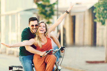 Happy Couple Riding a Bike