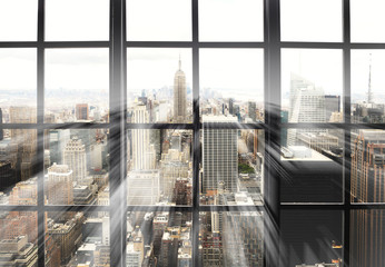 Large panoramic window with views of the city