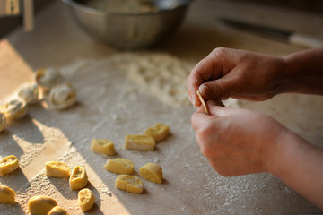 Process of making dumplings, raw ravioli in flour