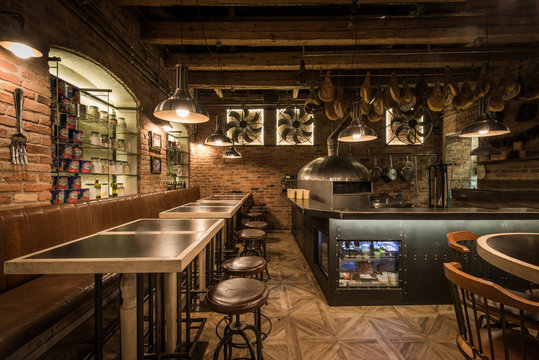 Interior of pizza restaurant with wood fired oven