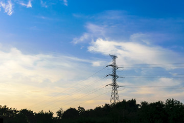 high voltage pole and bright blue sky