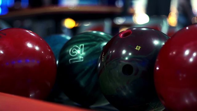 Colored bowling balls in bowling club close up