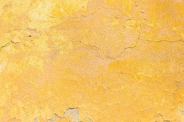 Old yellow cracked plaster