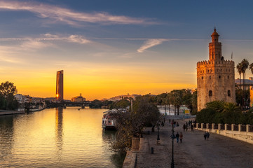 Golden tower in Seville and modern building