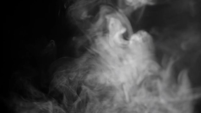 White cloud of cigarette smoke on black isolated background