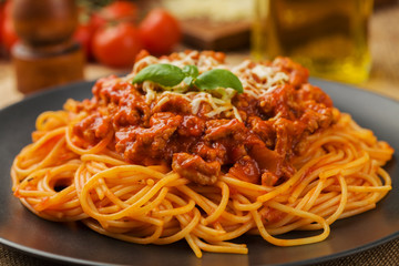 Delicious spaghetti served on a black plate