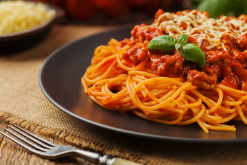Delicious spaghetti served on a black plate
