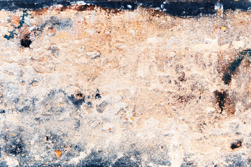 Wall fragment with scratches and cracks