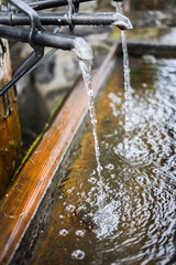 close up pf running water from fountain in Swiss - mineral water