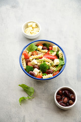 Pasta salad with vegetables and cheese. Concept of healthy eating, vegan food 
