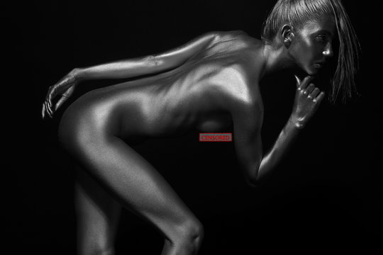 naked body in a silver body painting