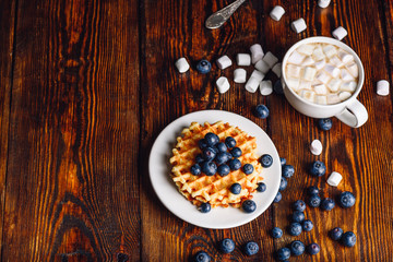 Waffles with Blueberry and Cup of Hot Chocolate.