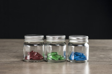Close up of red green and blue prescription pills 