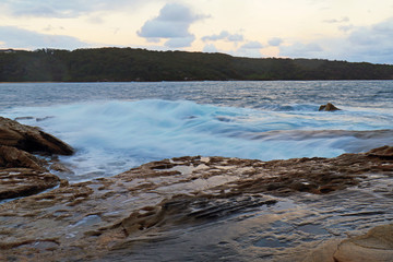 Water flow into rocks at La Perouse bay, Sydney, Australia