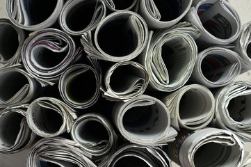 Close up shot of rolled newspapers texture