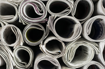 Close up shot of rolled newspapers texture