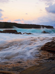 Waves flowing into rock formation at La Perouse bay, Sydney, Australia