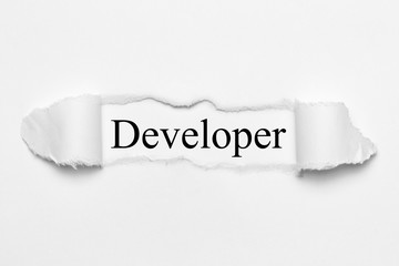 Developer on white torn paper