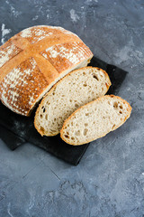 Homemade bread on a black background.