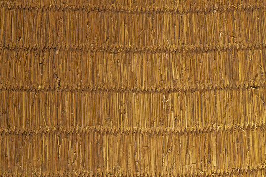 A wicker made of straw canvas. Craft, handmade.