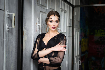 Portrait of a beautiful girl in a black negligee