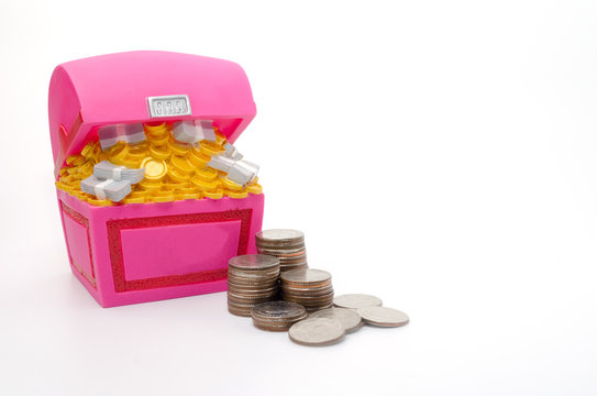 Piggy bank or Treasure Chest shaped money box with coins on white background, in saving money concept, copy space