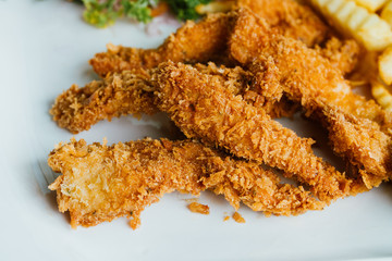 Chicken nuggets in breading. Appetizing chicken fillet nuggets in breaded.