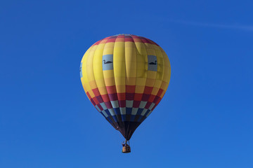 Naklejka premium Balloon floating above winery at Temecula Balloon Festival in Southern California