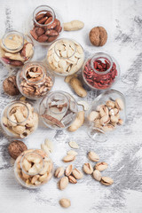 Fototapeta na wymiar Different nuts in jars
