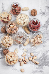 Fototapeta premium Different nuts in jars