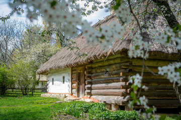 National Museum Pirogovo in the outdoors near Kiev. An old antique window with flowers in a vintage...
