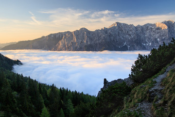 Sunrise above sea of clouds