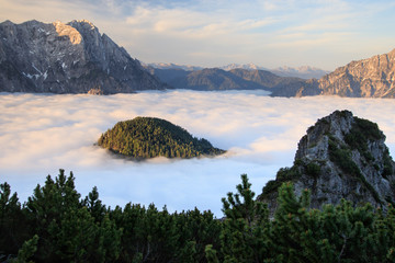 Sunrise above sea of clouds