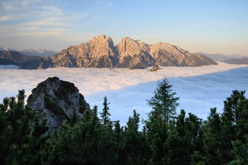 Sunrise above sea of clouds
