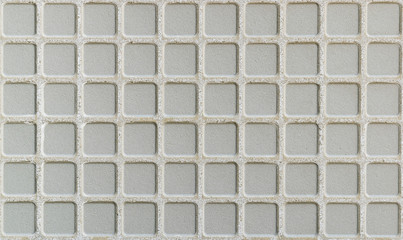 Closeup of lower surface of ceramic tile texture background.
