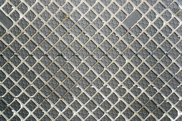 Closeup of lower surface of ceramic tile texture background.